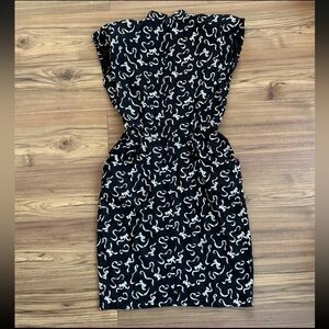 Vintage 80s Does 40s Strong Shoulder Side Pockets Black Ivory Bow Print Dress